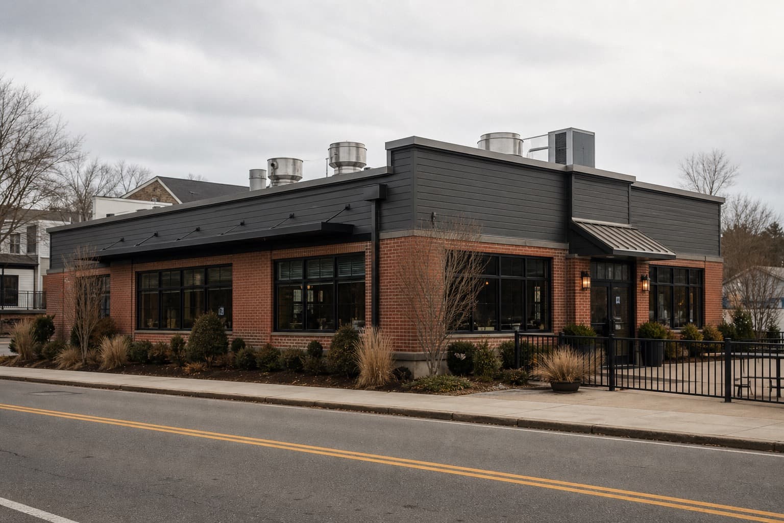 Flat low-slope roof with kitchen exhaust units over a New England restaurant